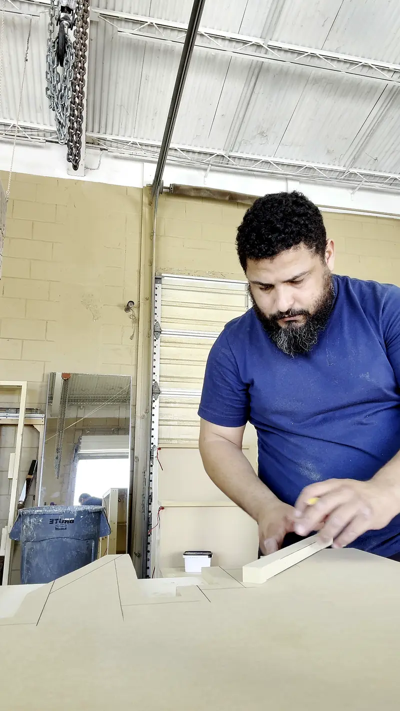 Squaring up and marking the cut line by hand on the bench
